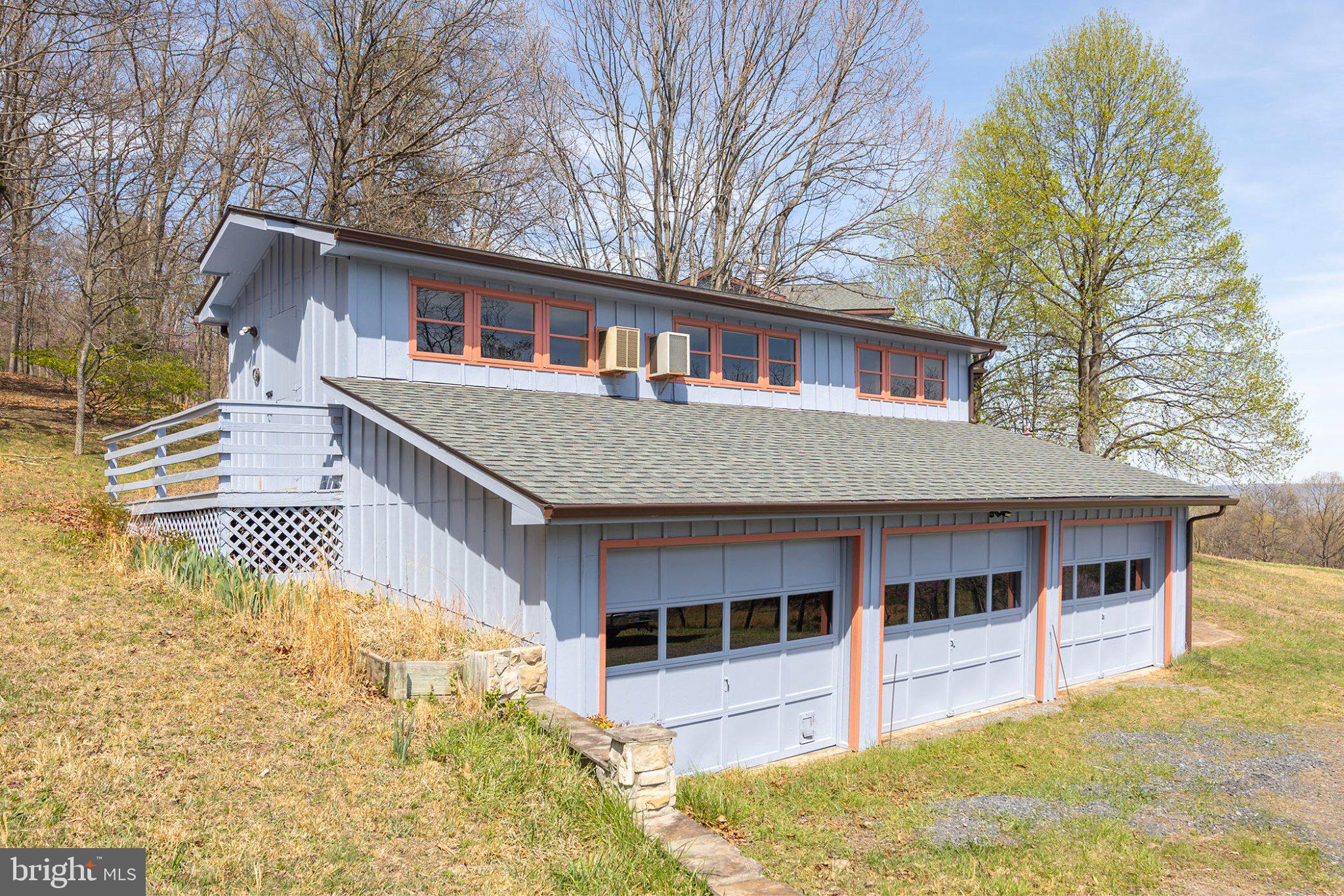 777 Glengary Road Winchester, VA 22603 - Photo 68 of 69 a front view of a house with a garden and trees