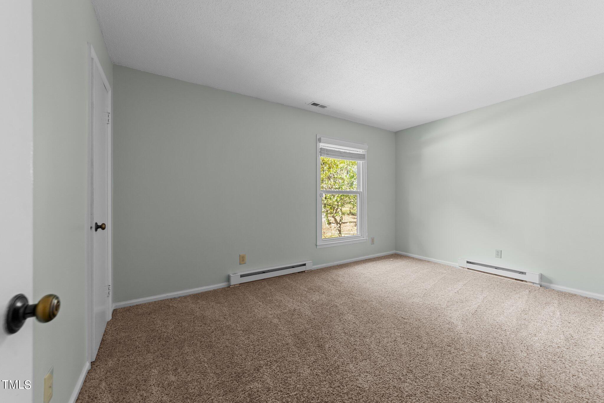 1104 Terrace Court Raleigh, NC 27615 - Photo 16 of 39 a view of an empty room with a window