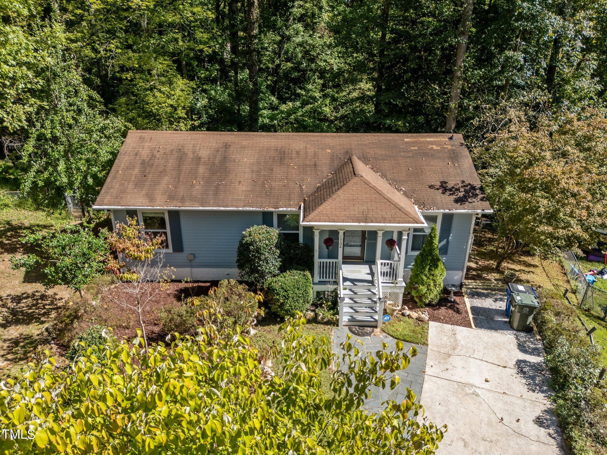 1104 Terrace Court Raleigh, NC 27615 - Photo 36 of 39 a aerial view of a house with table and chairs under an umbrella