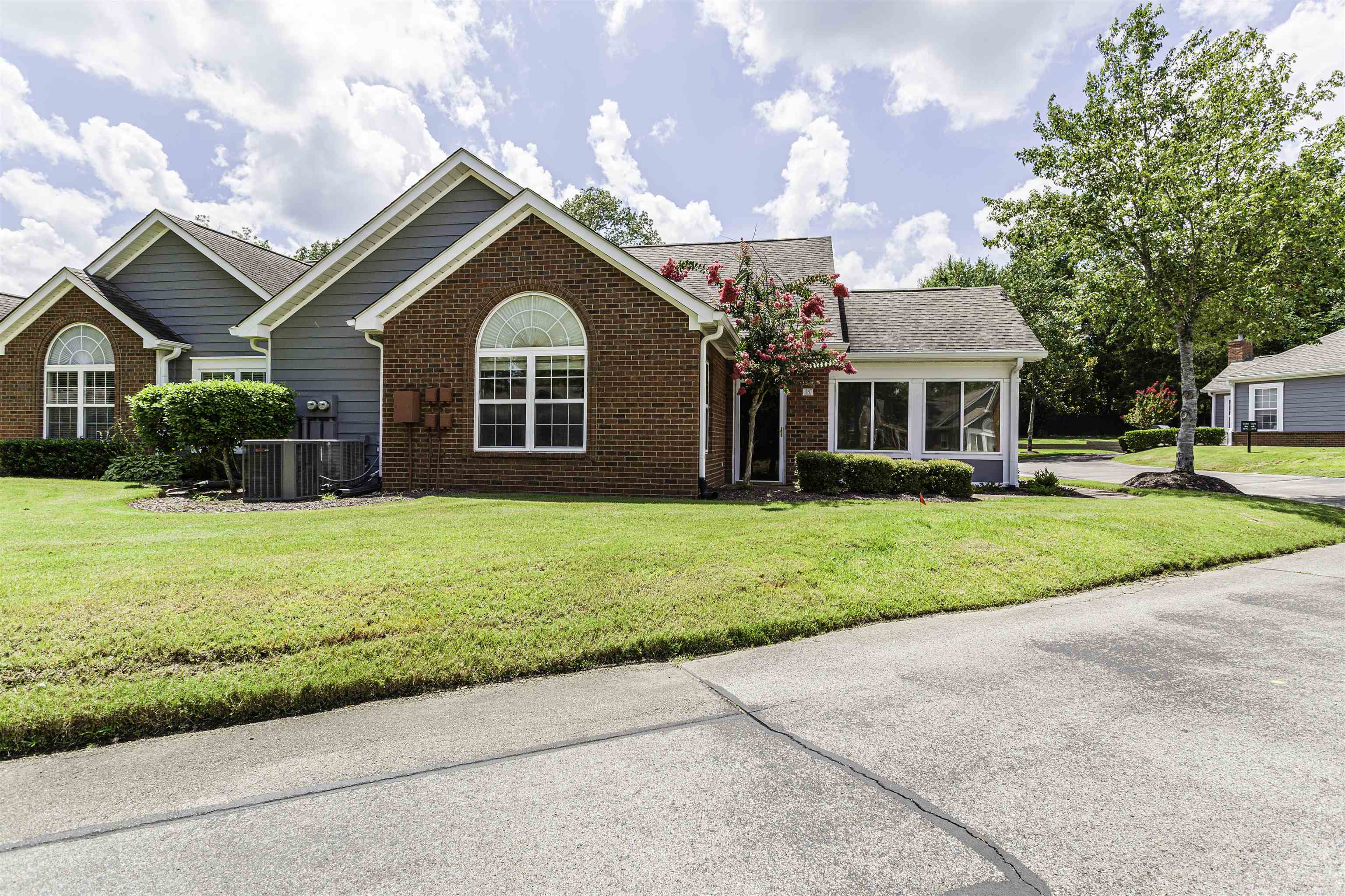 1187 Oak Timber Circle, Unit 33 Collierville, TN 38017 - Photo 11 of 22 a front view of a house with garden