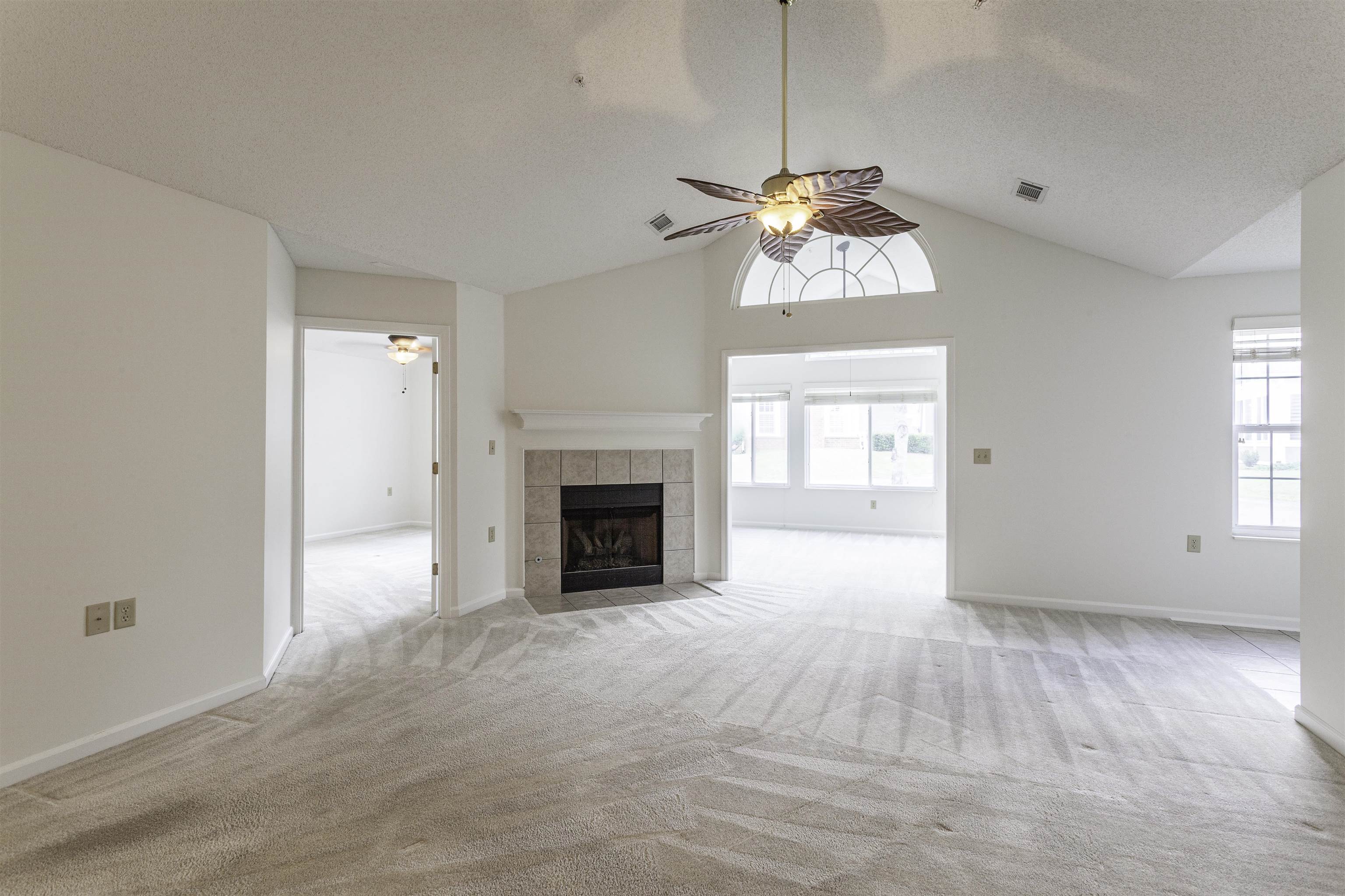 1187 Oak Timber Circle, Unit 33 Collierville, TN 38017 - Photo 2 of 22 a view of an empty room with a window and fireplace