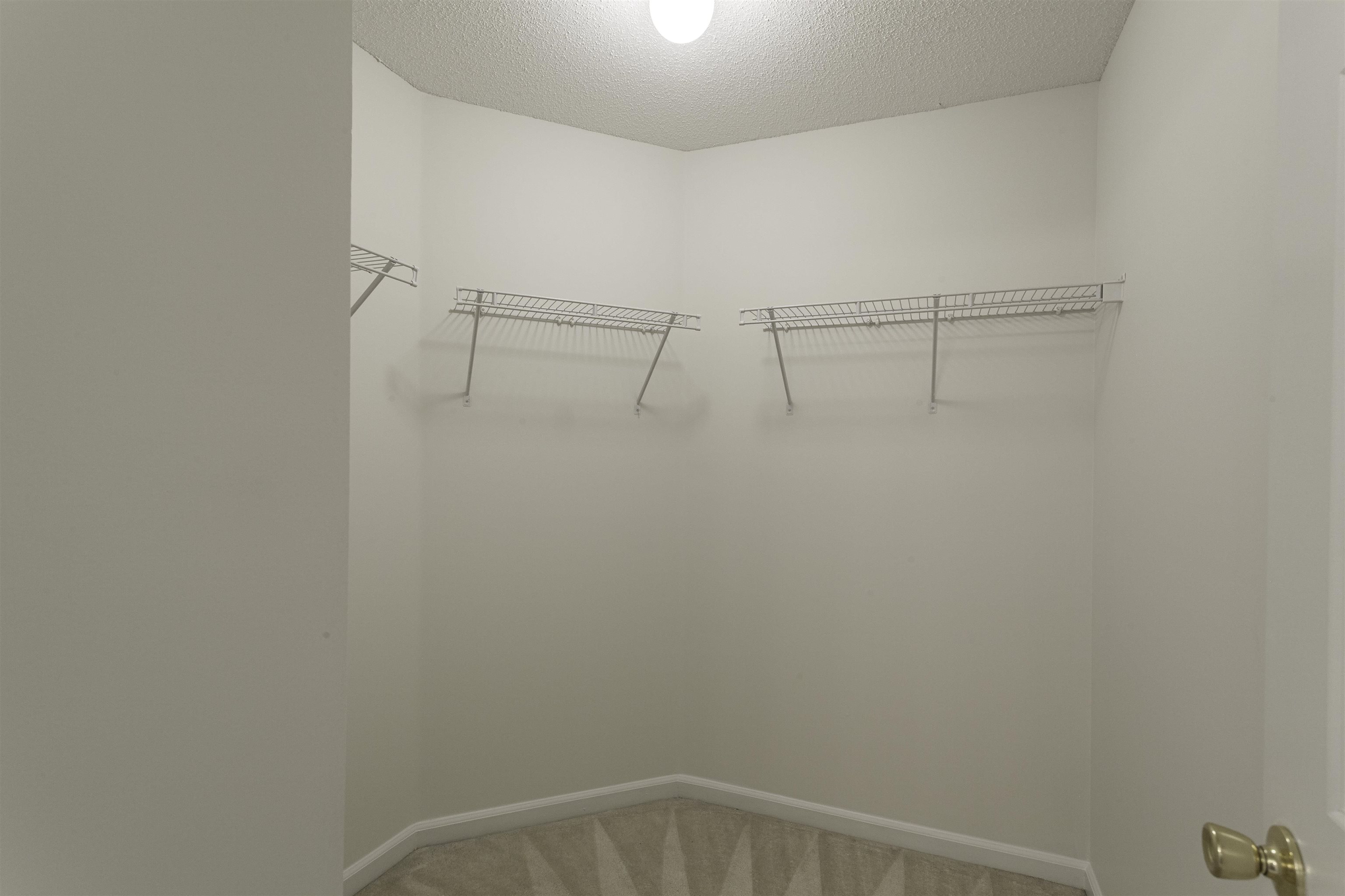 1187 Oak Timber Circle, Unit 33 Collierville, TN 38017 - Photo 6 of 22 a view of a room with racks on the wall