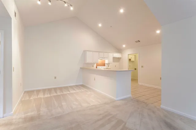a view of kitchen with center island and wooden floor