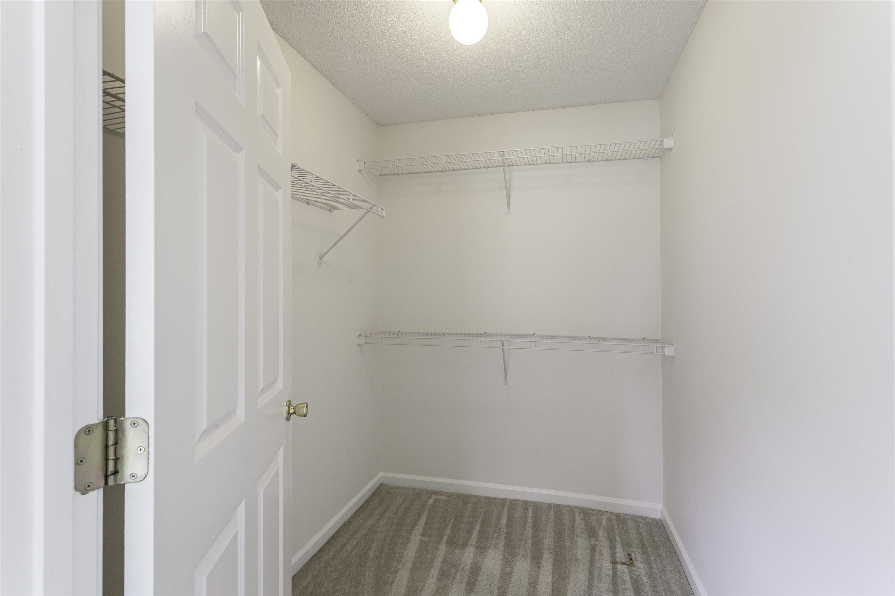 1187 Oak Timber Circle, Unit 33 Collierville, TN 38017 - Photo 8 of 22 a view of a room with racks on the wall