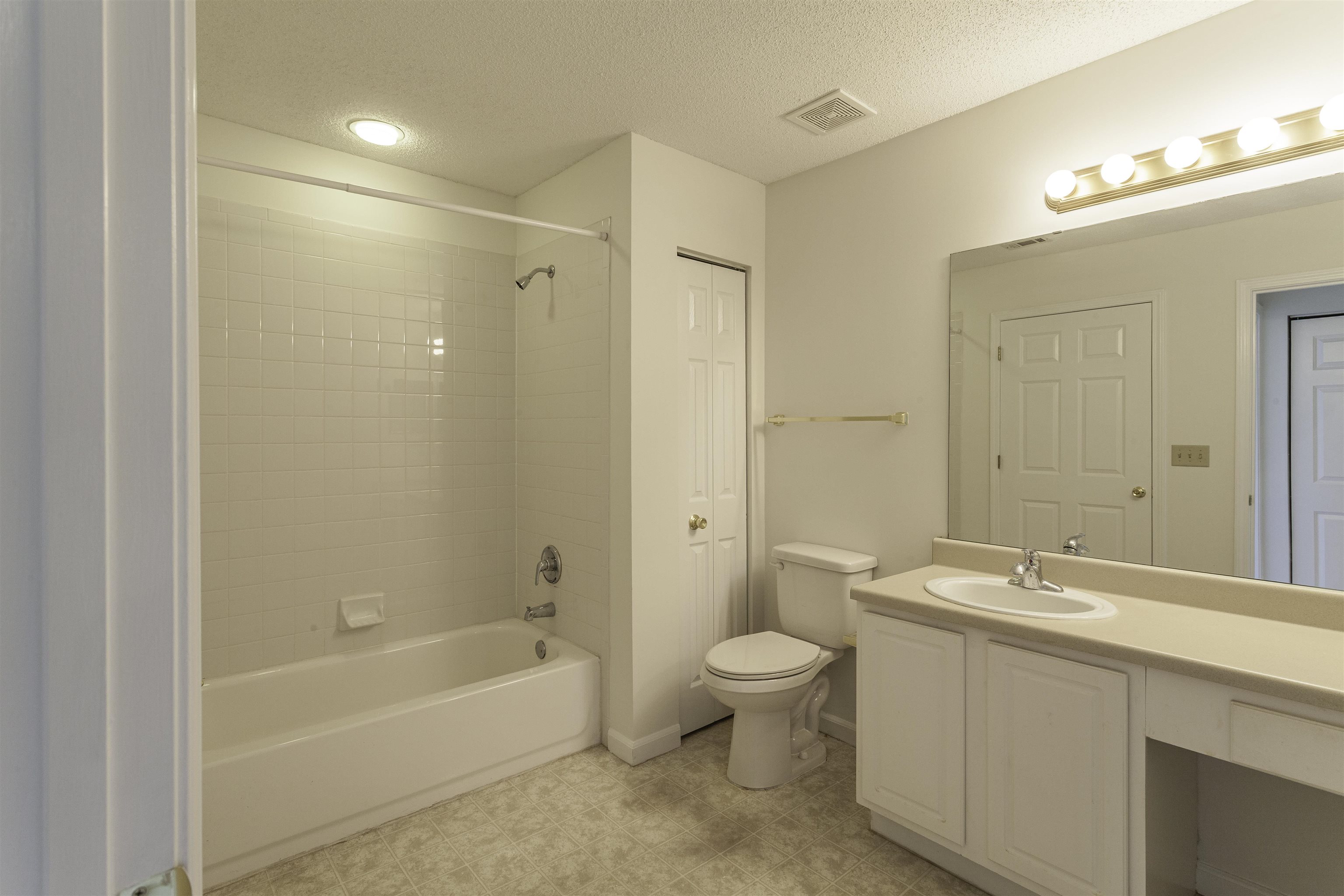 1187 Oak Timber Circle, Unit 33 Collierville, TN 38017 - Photo 10 of 22 a bathroom with a bathtub shower sink mirror and toilet