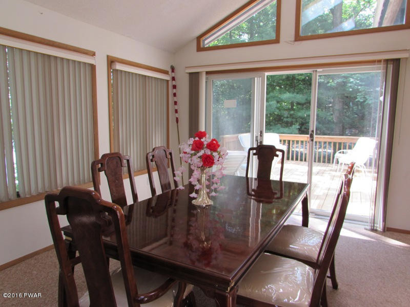125 Rodeo Lane Hawley, PA 18428 - Photo 9 of 43 a view of a dining room with furniture window and outside view