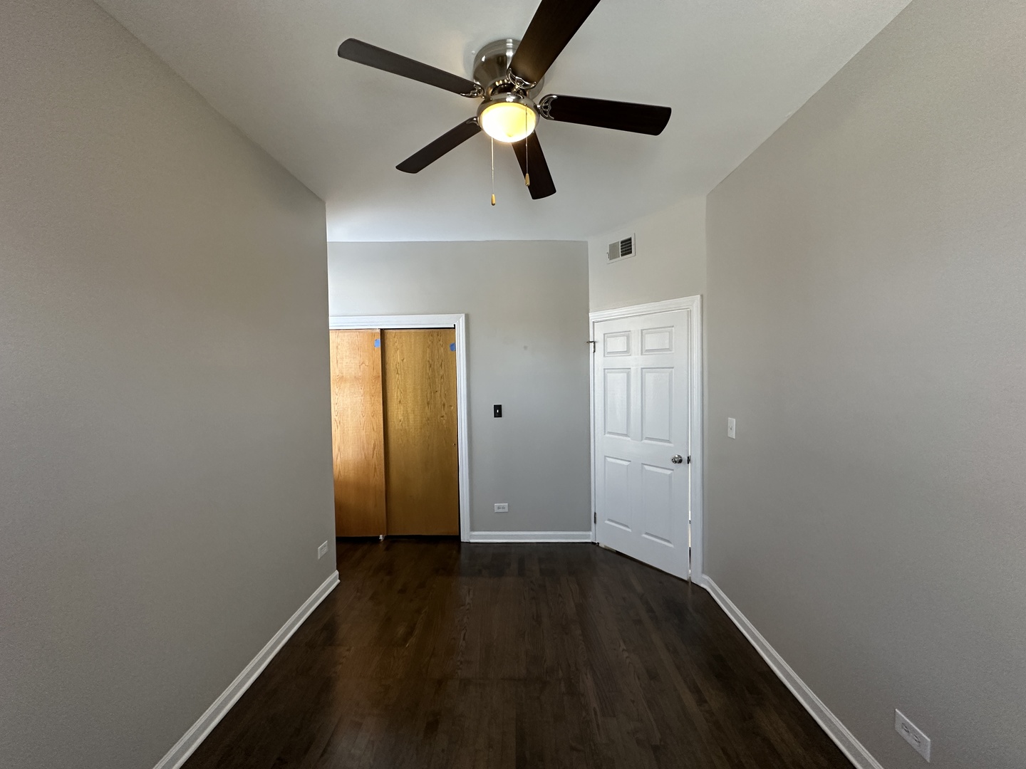 3946 North Cicero Avenue, Unit 1 Chicago, IL 60641 - Photo 11 of 17 an empty room with wooden floor closet and windows