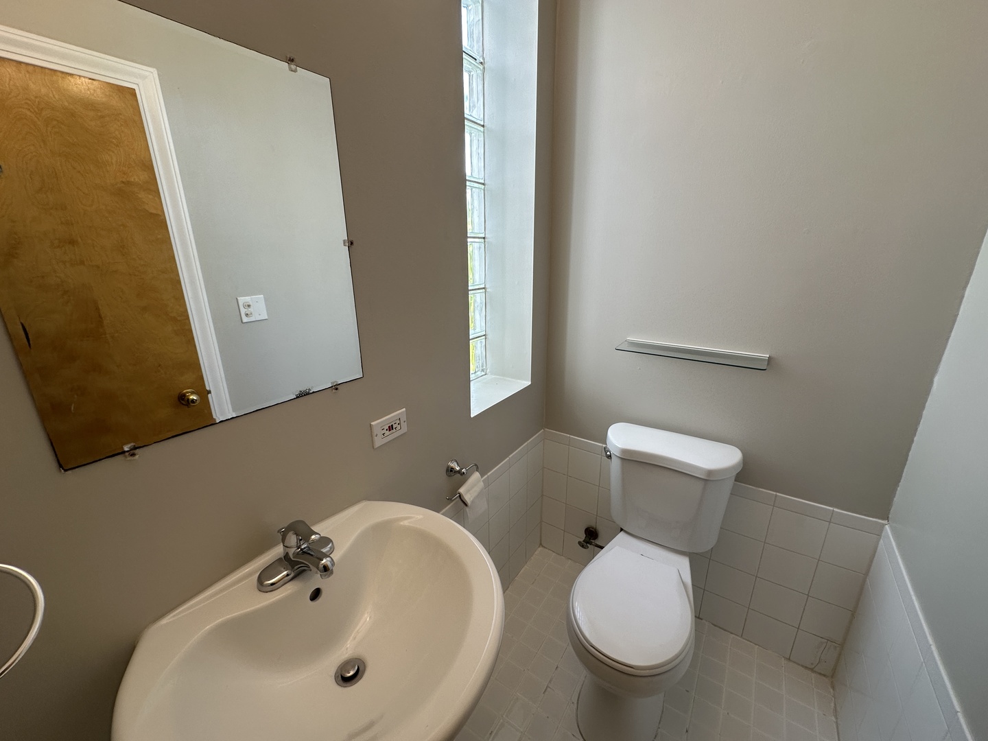 3946 North Cicero Avenue, Unit 1 Chicago, IL 60641 - Photo 16 of 17 a bathroom with a toilet sink and mirror