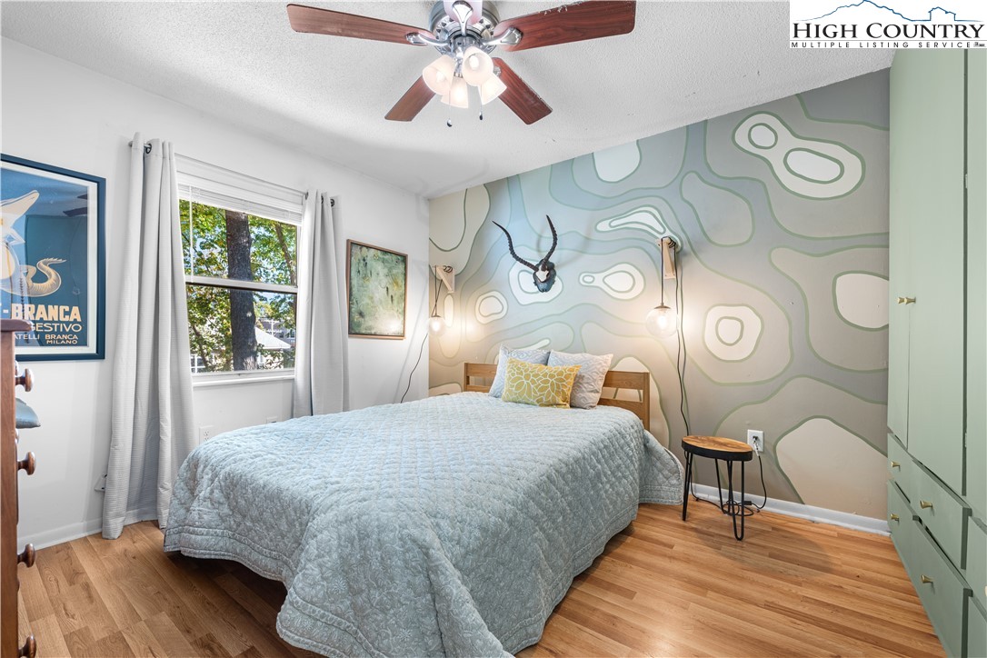 229 East King Street, Unit 17 Boone, NC 28607 - Photo 13 of 22 a bedroom with a bed and a window