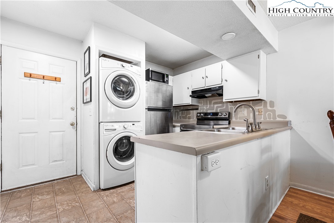 229 East King Street, Unit 17 Boone, NC 28607 - Photo 5 of 22 a utility room with sink dryer and washer
