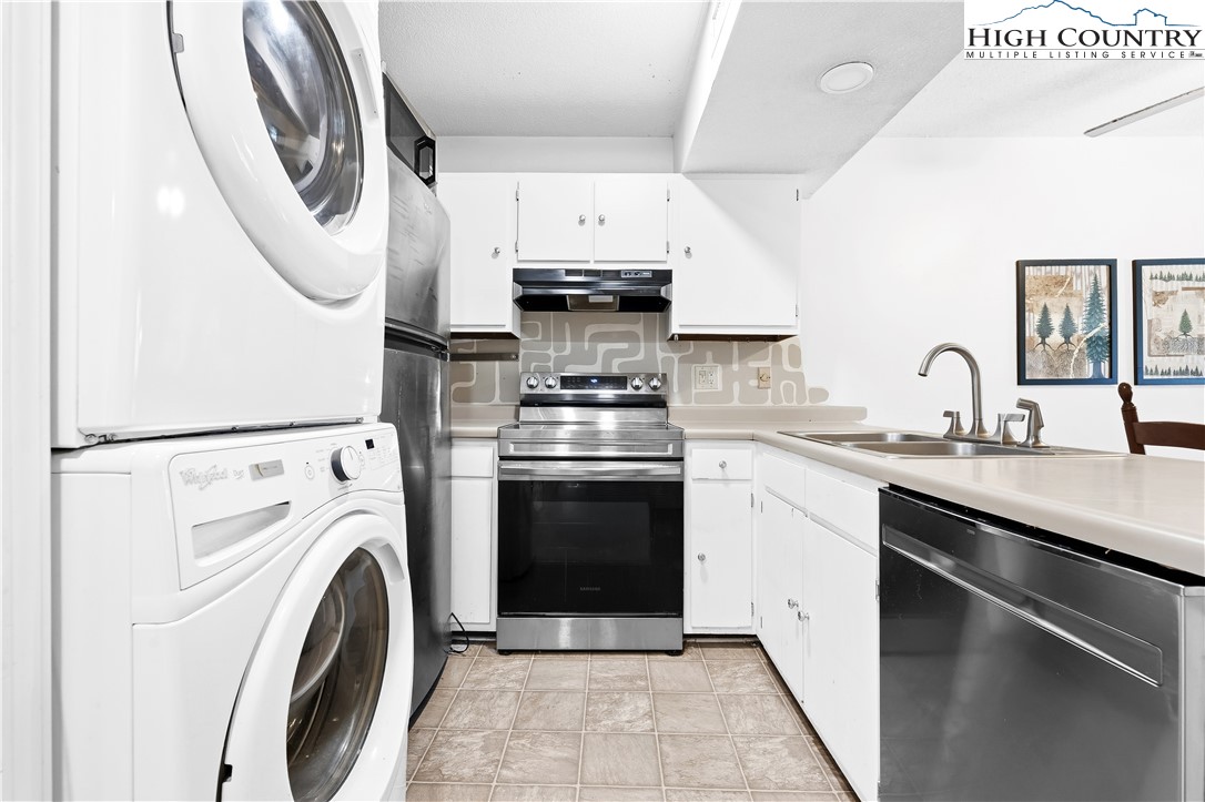 229 East King Street, Unit 17 Boone, NC 28607 - Photo 6 of 22 a kitchen with stainless steel appliances granite countertop a stove and a sink