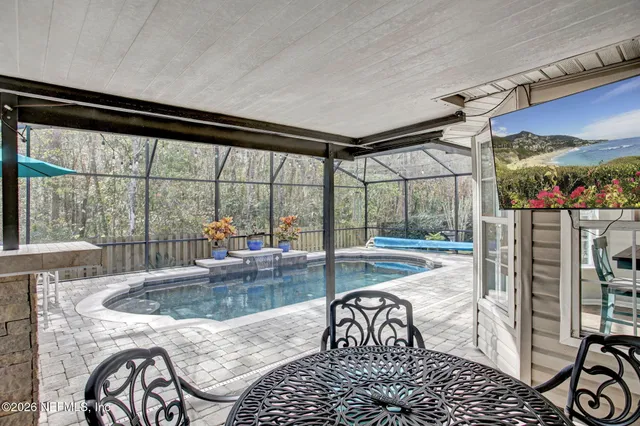 a view of a patio with a table and chairs