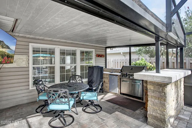 a table and chairs in a balcony