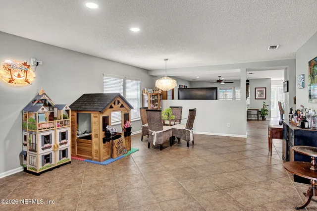 a bedroom with furniture and a book shelf