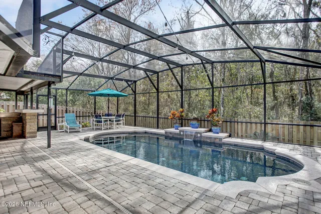 a view of a swimming pool with a patio