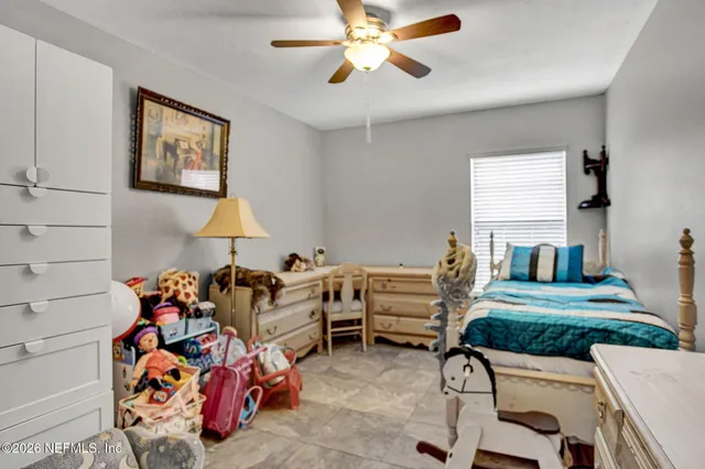 a living room filled with furniture and a chandelier