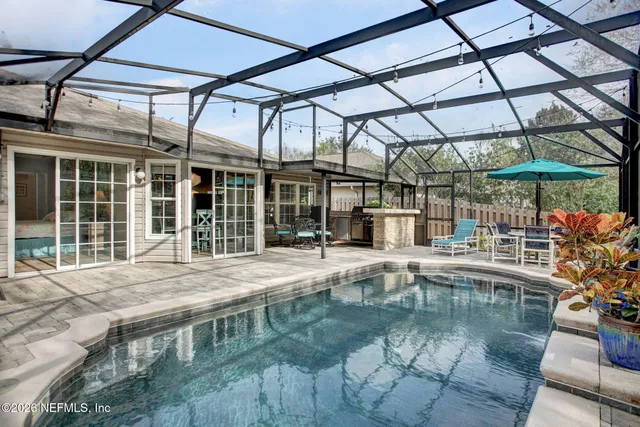 a view of a swimming pool with a patio