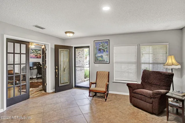 a living room with furniture and a window