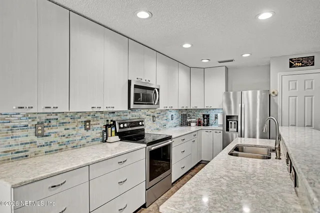 a large kitchen with cabinets