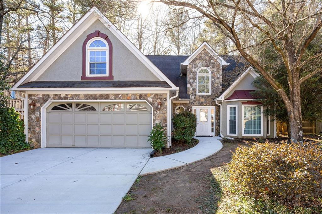 3278 Country Walk Drive Powder Springs, GA 30127 - Photo 1 of 1 a front view of a house with a yard and garage