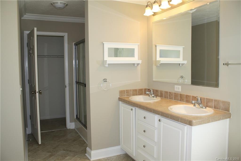 10866 Barberville Road Indian Land, SC 29707 - Photo 15 of 20 a bathroom with a sink and a mirror