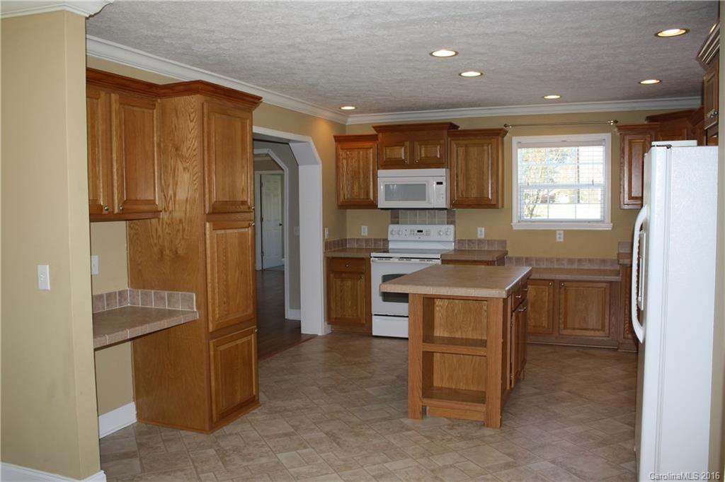 10866 Barberville Road Indian Land, SC 29707 - Photo 7 of 20 a kitchen with refrigerator cabinets and a sink