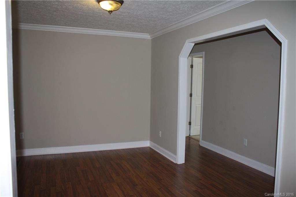 10866 Barberville Road Indian Land, SC 29707 - Photo 10 of 20 a view of an empty room with wooden floor and window
