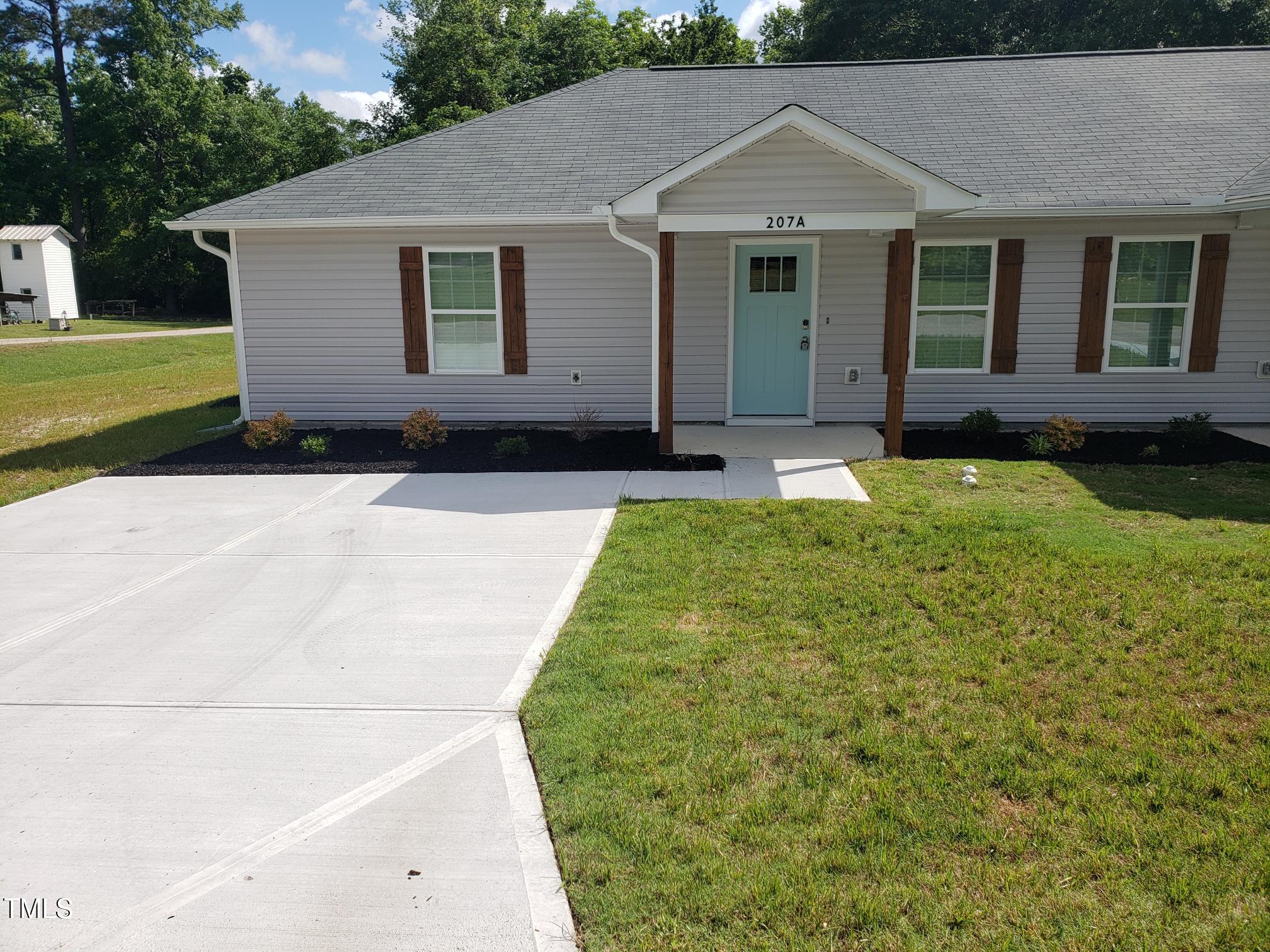 207 South Nash Street, Unit A Bunn, NC 27508 - Photo 1 of 11 20240511_101436