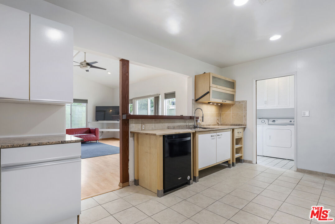 7716 Thousand Oaks Drive Tujunga, CA 91042 - Photo 14 of 34 a kitchen with a stove top oven and cabinets
