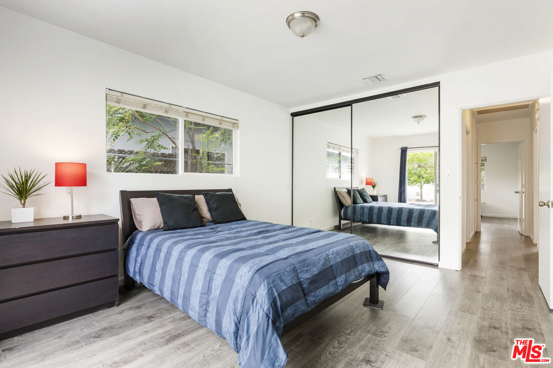 7716 Thousand Oaks Drive Tujunga, CA 91042 - Photo 20 of 34 a bedroom with a bed and a dresser