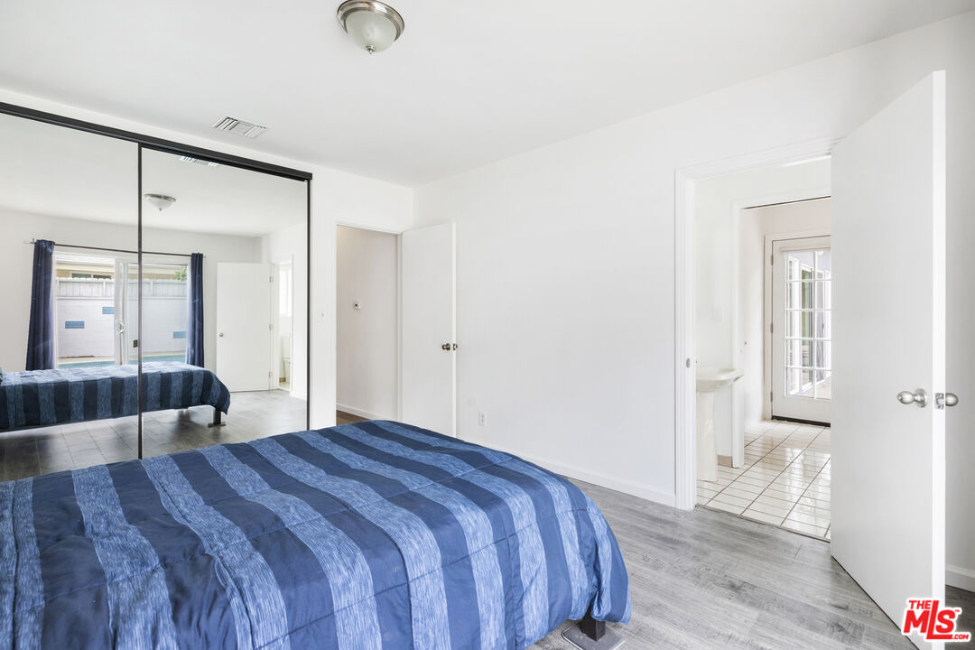 7716 Thousand Oaks Drive Tujunga, CA 91042 - Photo 22 of 34 a bedroom with a bed and a walk in closet