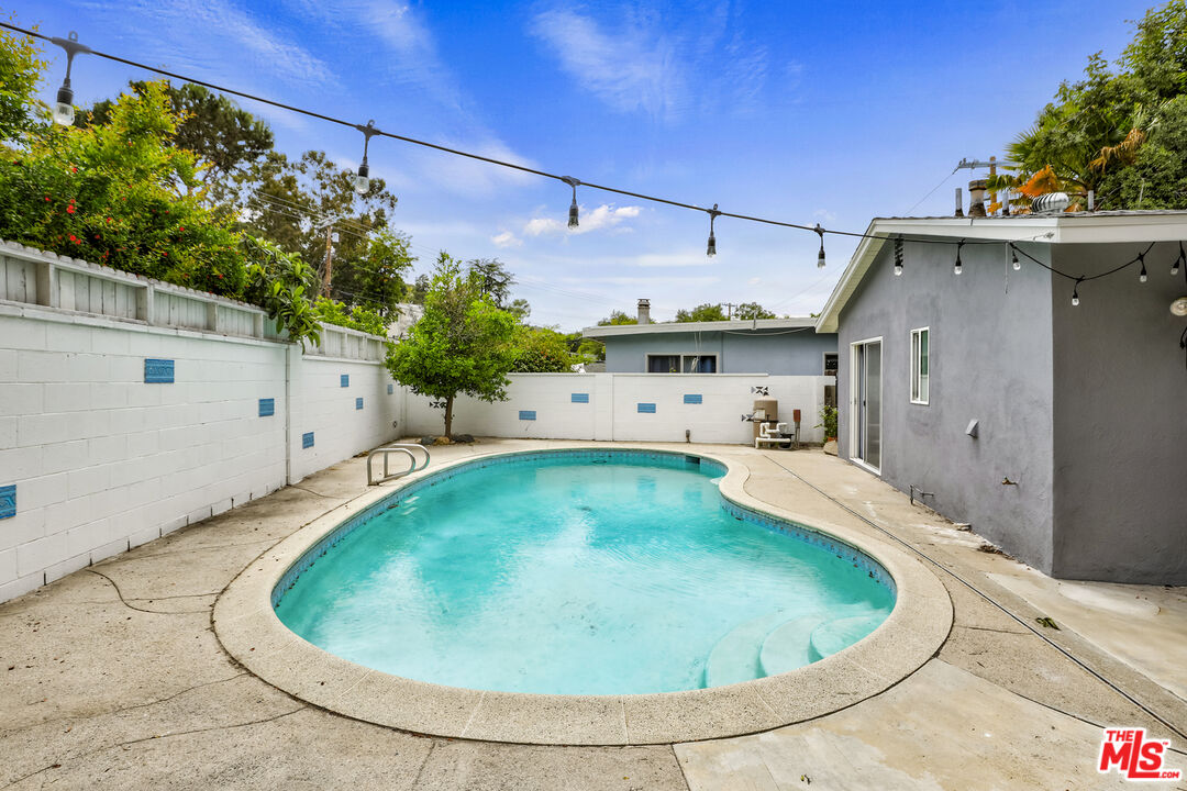 7716 Thousand Oaks Drive Tujunga, CA 91042 - Photo 30 of 34 a view of a swimming pool with a yard