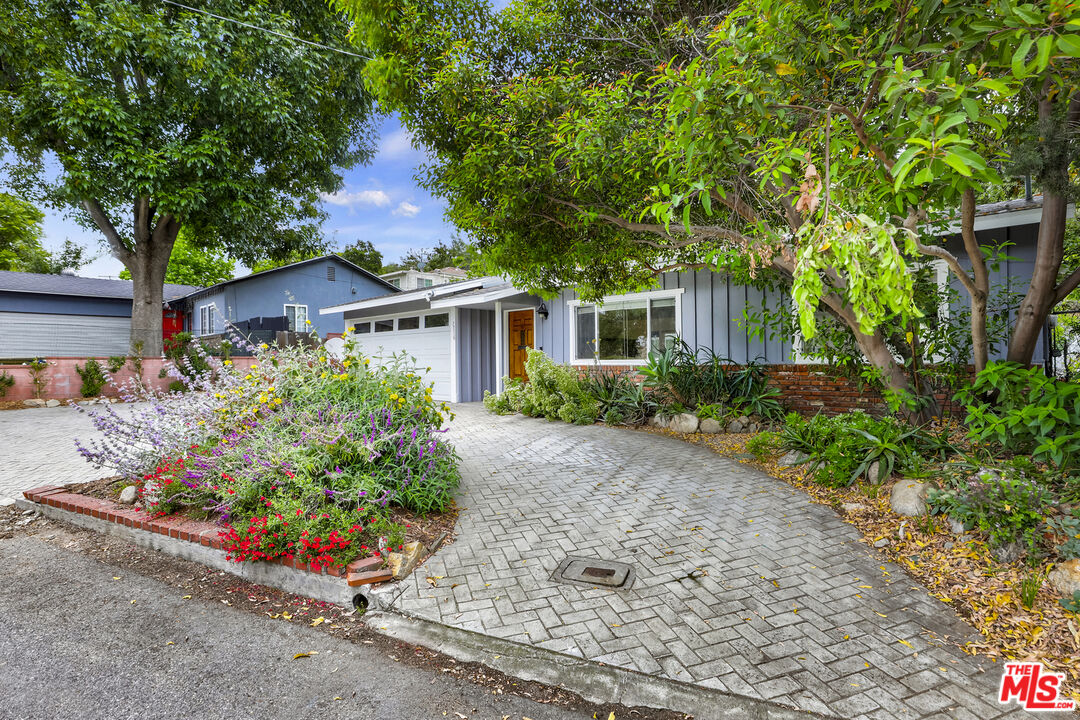 7716 Thousand Oaks Drive Tujunga, CA 91042 - Photo 3 of 34 front view of house with potted plants