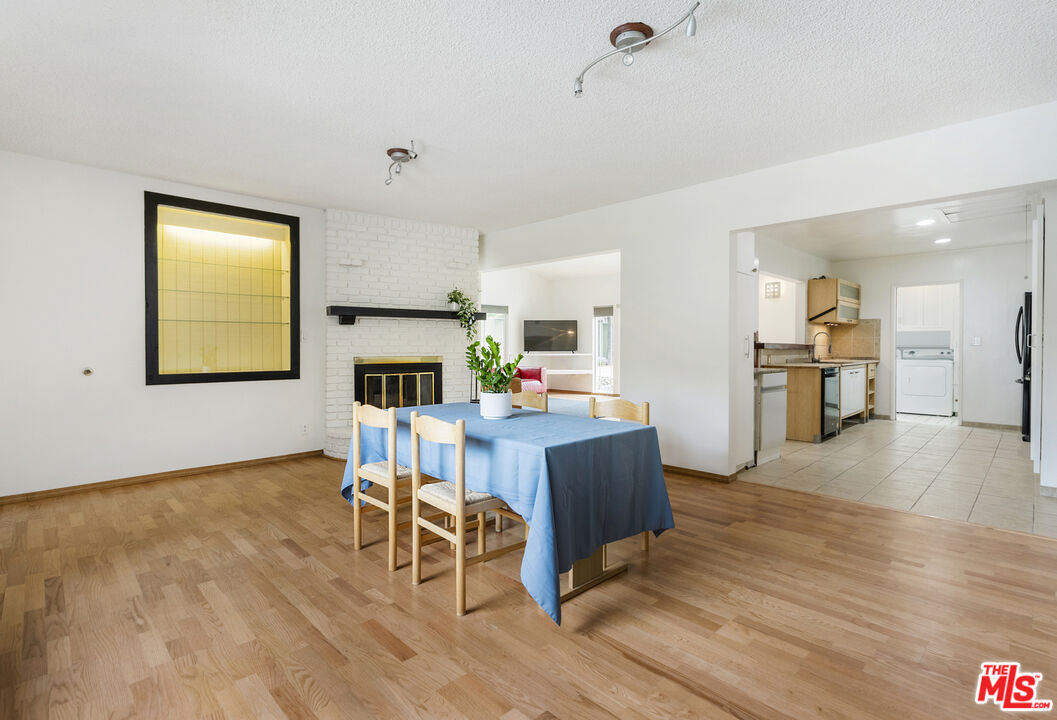 7716 Thousand Oaks Drive Tujunga, CA 91042 - Photo 6 of 34 a living room with furniture and a wooden floor
