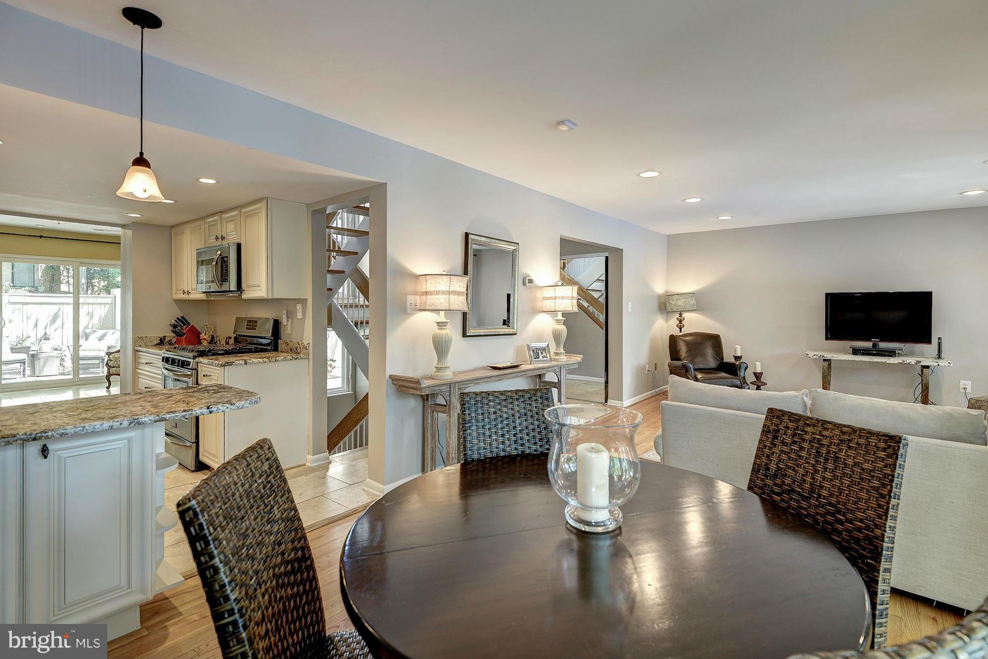1620 Waters Edge Lane Reston, VA 20190 - Photo 11 of 30 a living room with furniture kitchen view and a wooden floor