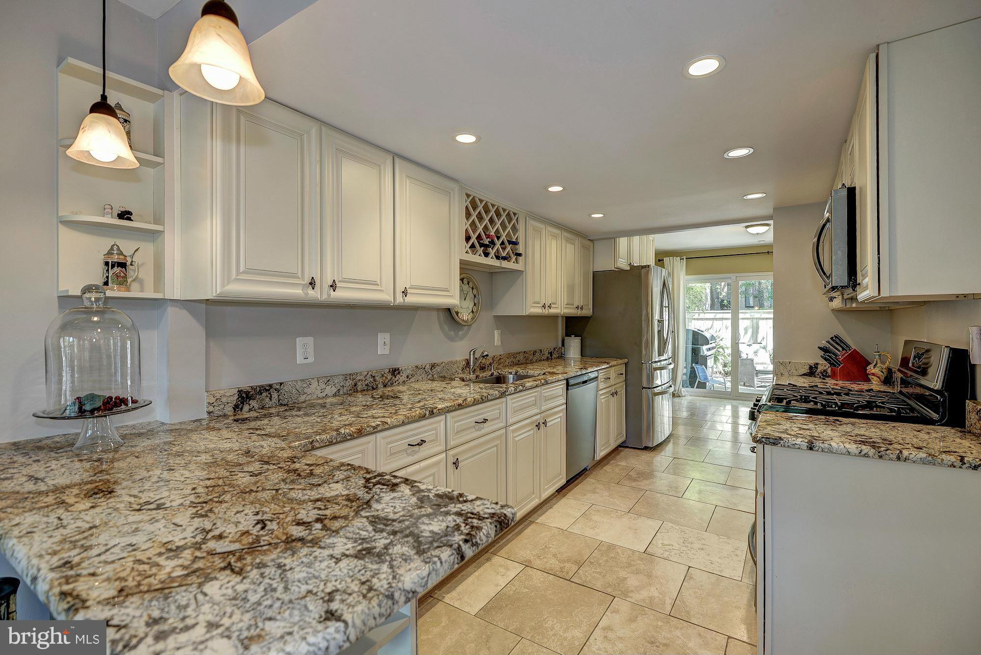 1620 Waters Edge Lane Reston, VA 20190 - Photo 13 of 30 a kitchen with a stove a sink a refrigerator and cabinets