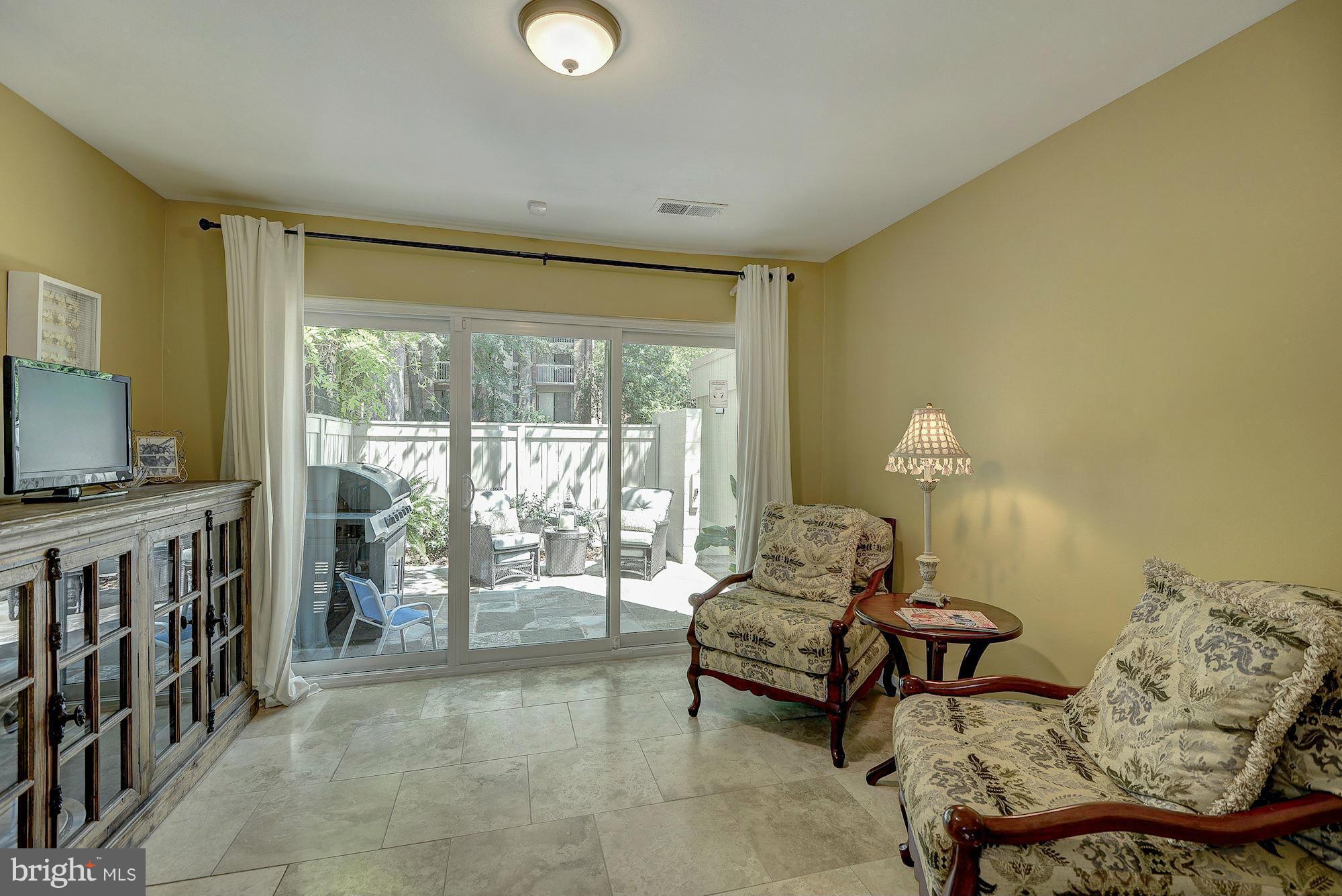 1620 Waters Edge Lane Reston, VA 20190 - Photo 15 of 30 a living room with furniture and a flat screen tv