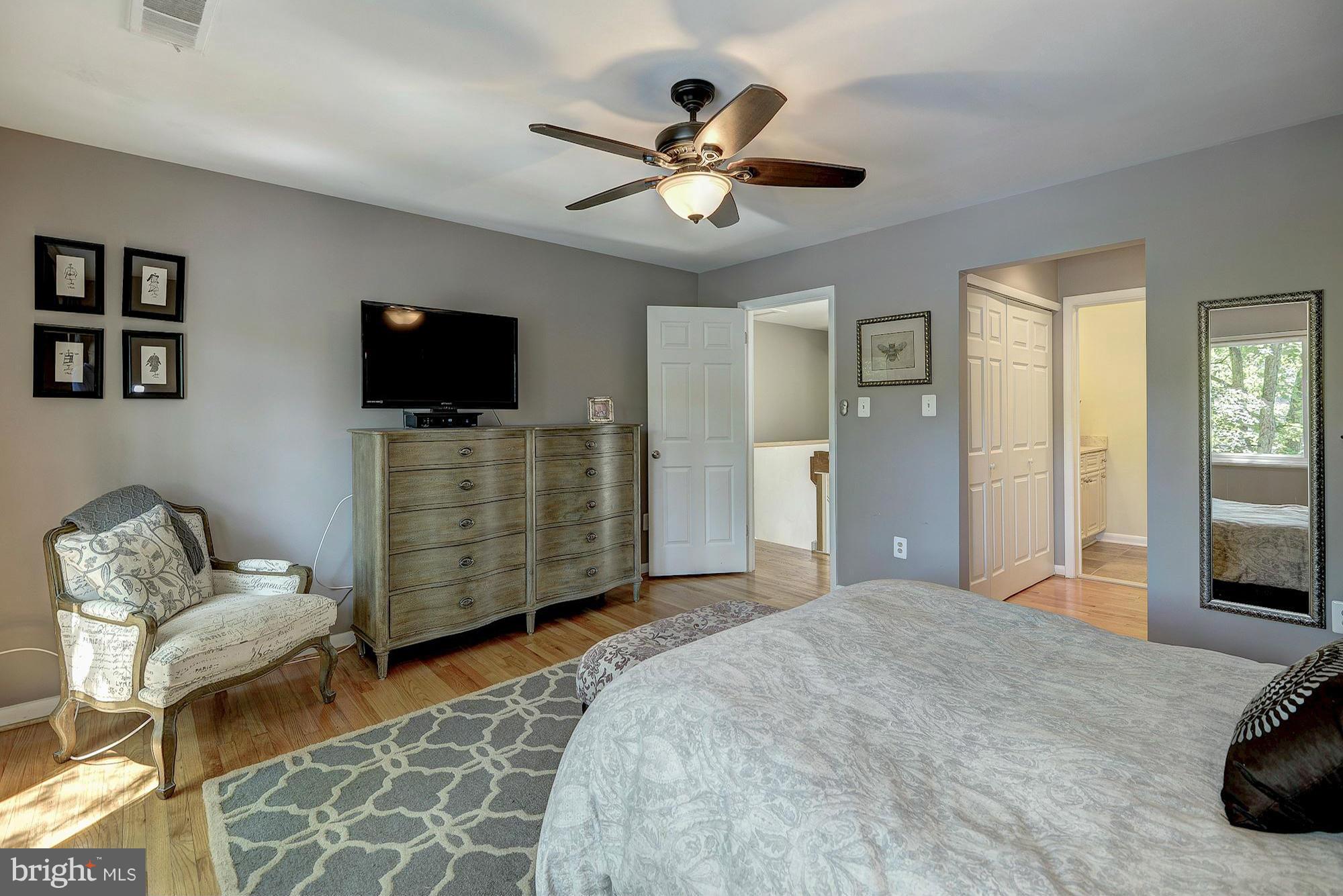 1620 Waters Edge Lane Reston, VA 20190 - Photo 18 of 30 a bedroom with furniture and a flat screen tv