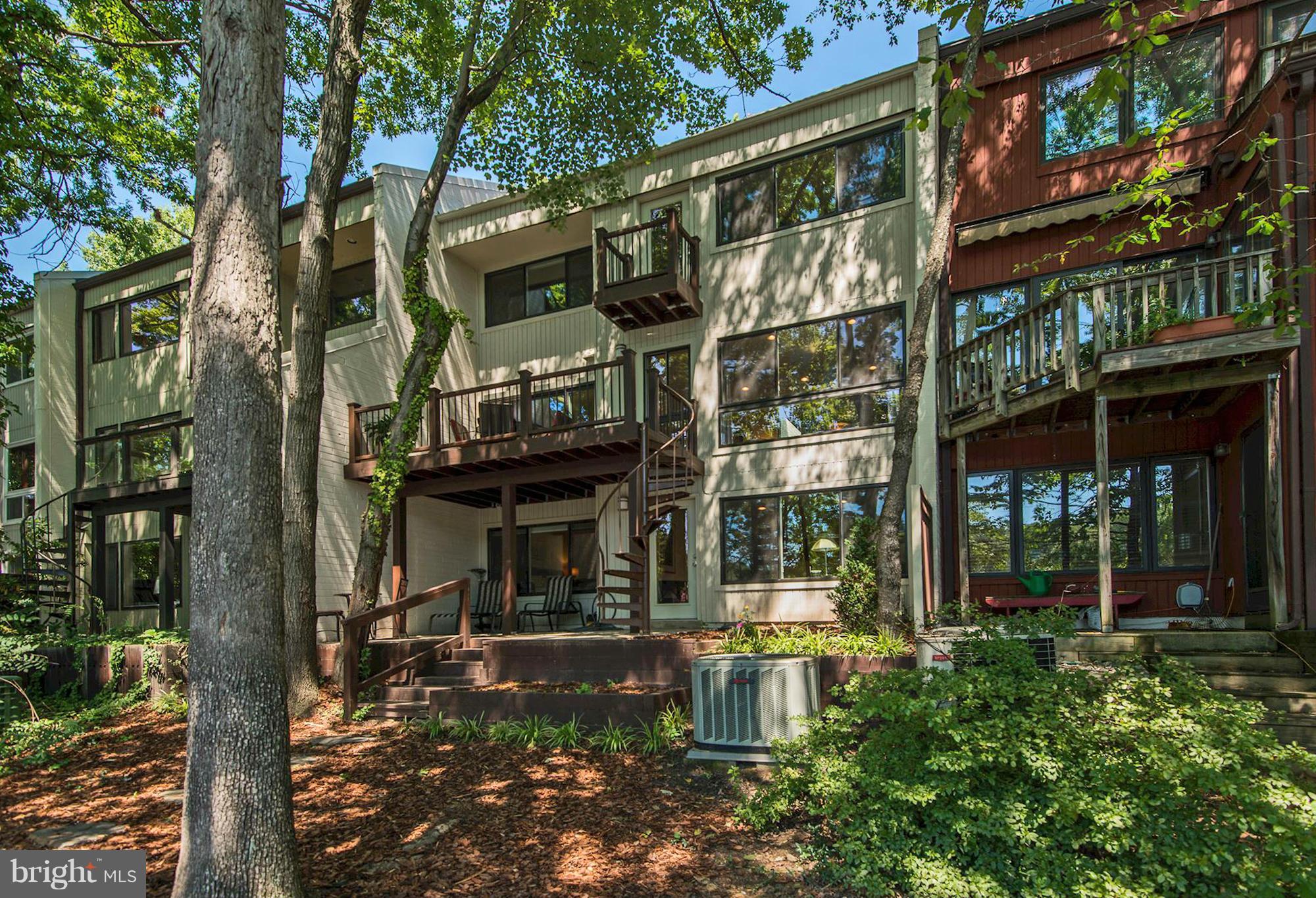 1620 Waters Edge Lane Reston, VA 20190 - Photo 28 of 30 a front view of a building with a garden