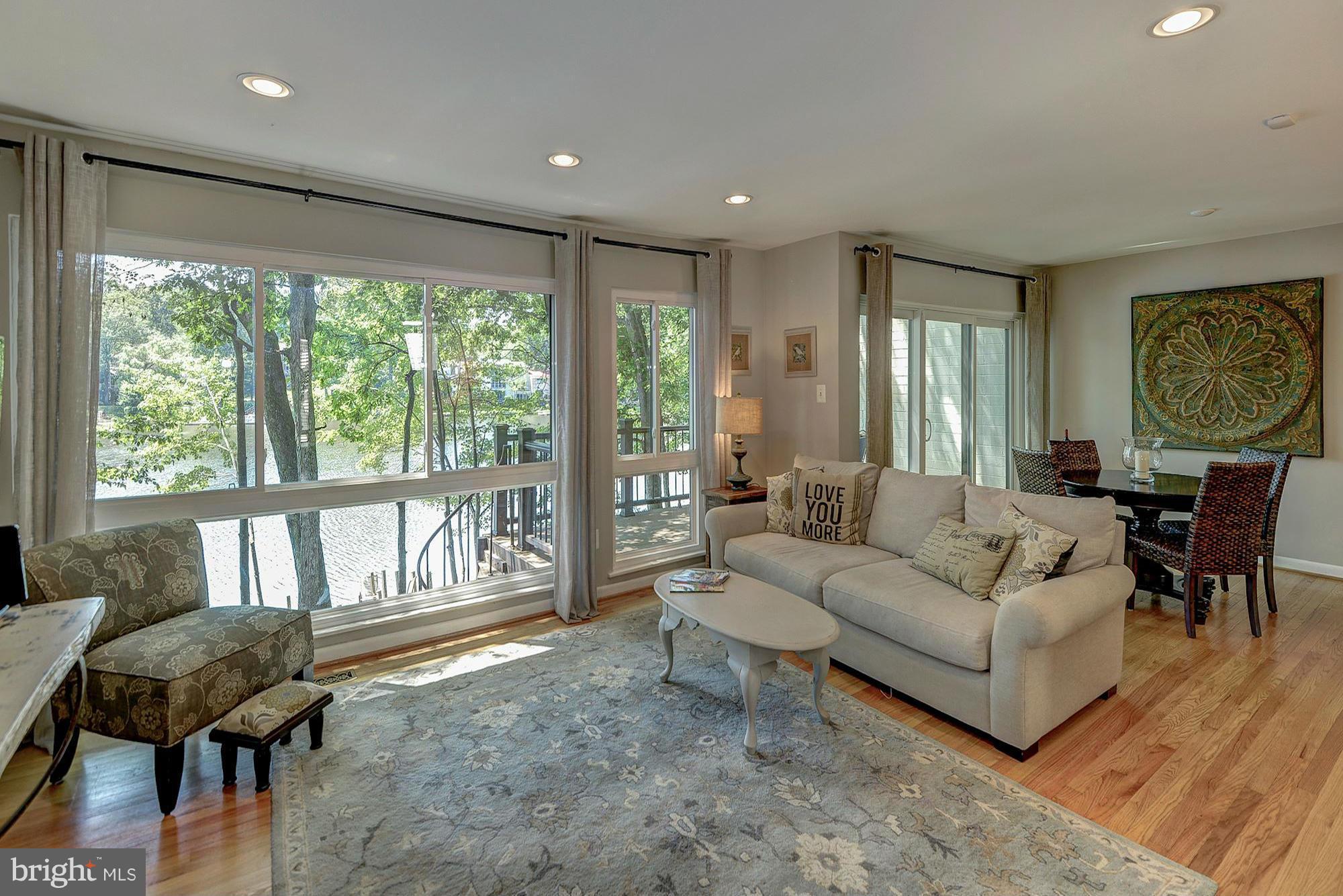 1620 Waters Edge Lane Reston, VA 20190 - Photo 6 of 30 a living room with furniture and a large window