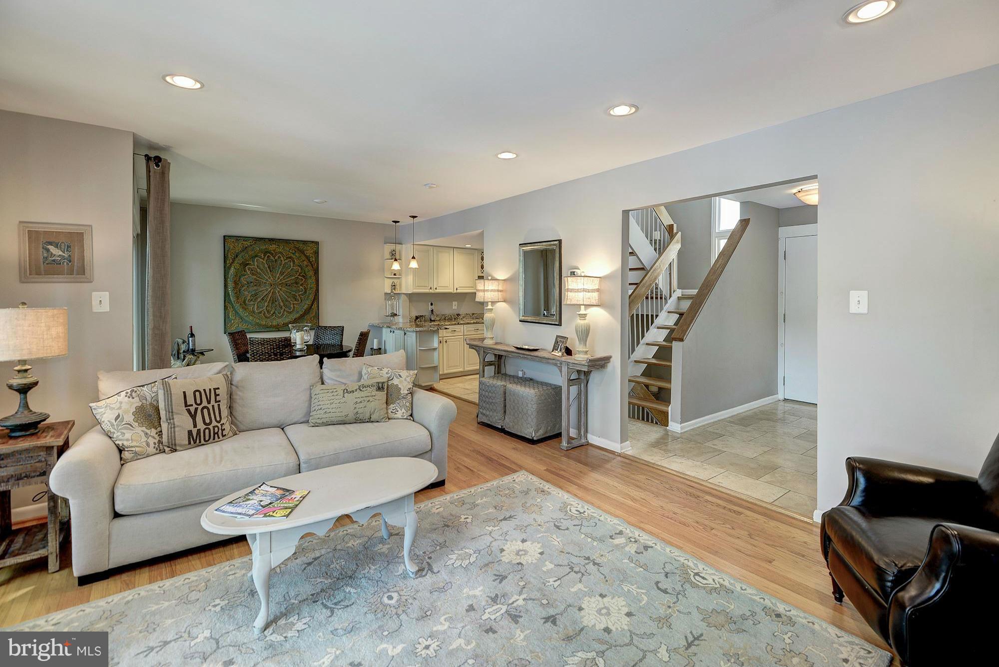 1620 Waters Edge Lane Reston, VA 20190 - Photo 7 of 30 a living room with furniture and a chandelier