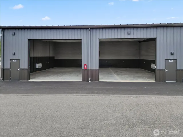 a view of parking area and garage