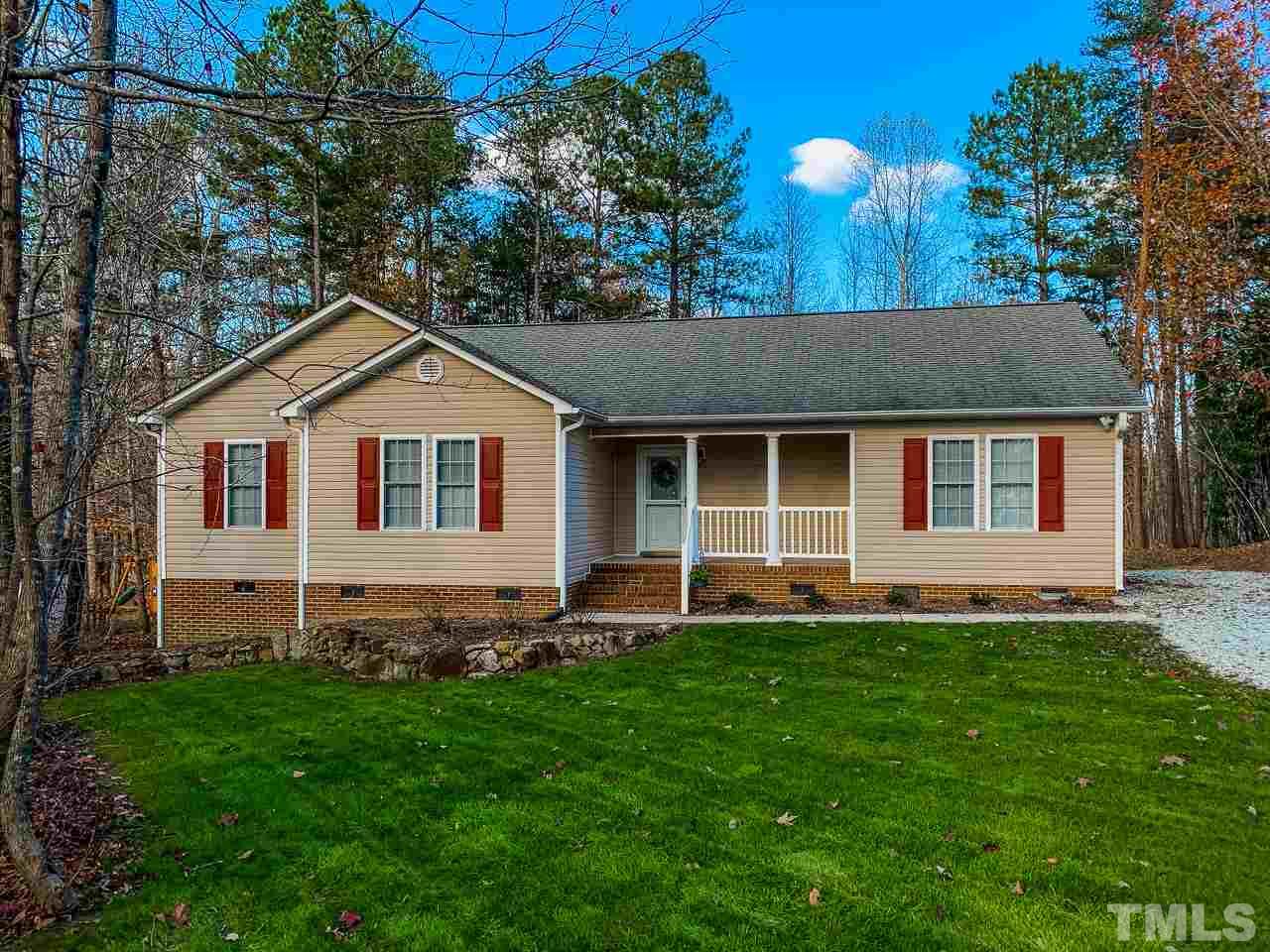 342 Punch Hill Farm Road Rougemont, NC 27572 - Photo 1 of 30 a front view of a house with a yard and garage