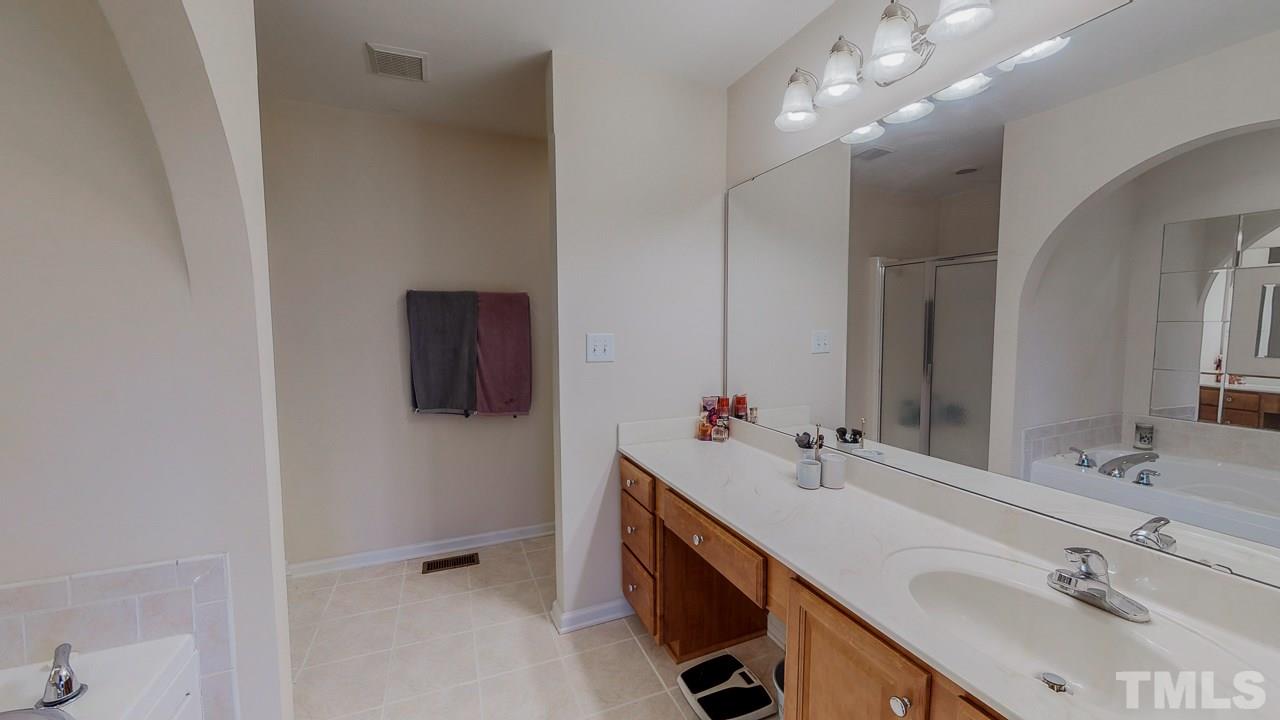 342 Punch Hill Farm Road Rougemont, NC 27572 - Photo 14 of 30 a bathroom with double vanity and a mirror