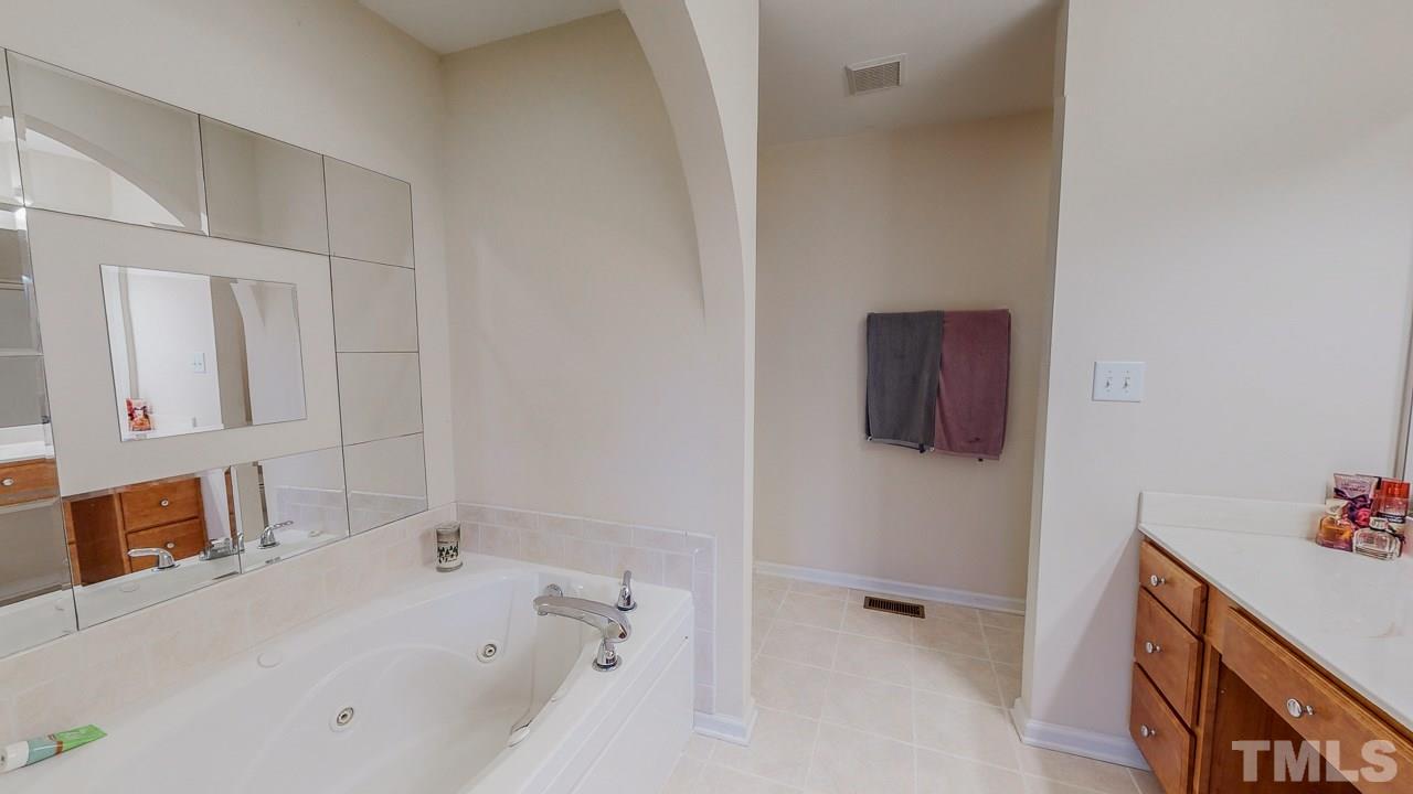 342 Punch Hill Farm Road Rougemont, NC 27572 - Photo 15 of 30 a bathroom with a bathtub and a sink