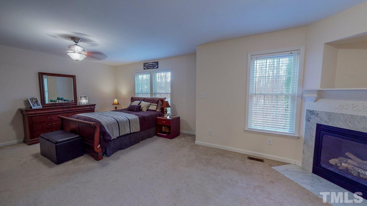 342 Punch Hill Farm Road Rougemont, NC 27572 - Photo 17 of 30 a bedroom with a bed and a couch
