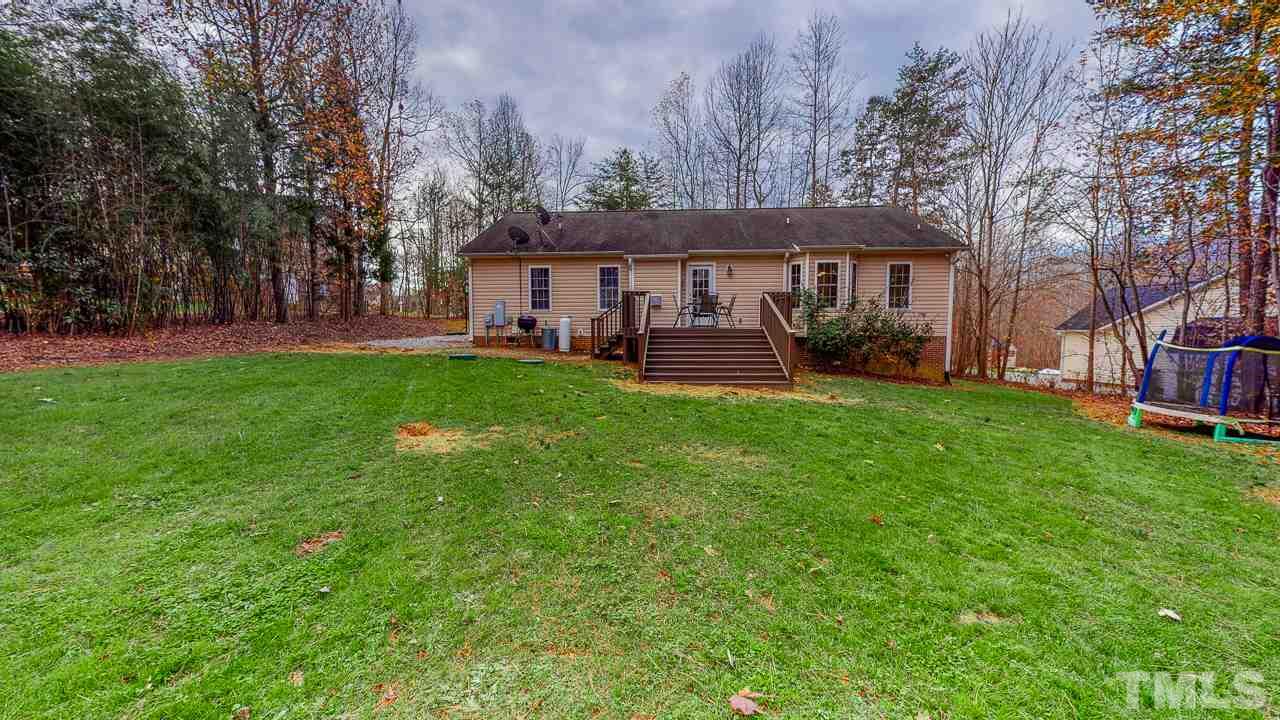 342 Punch Hill Farm Road Rougemont, NC 27572 - Photo 18 of 30 a view of a house with a yard porch and sitting area