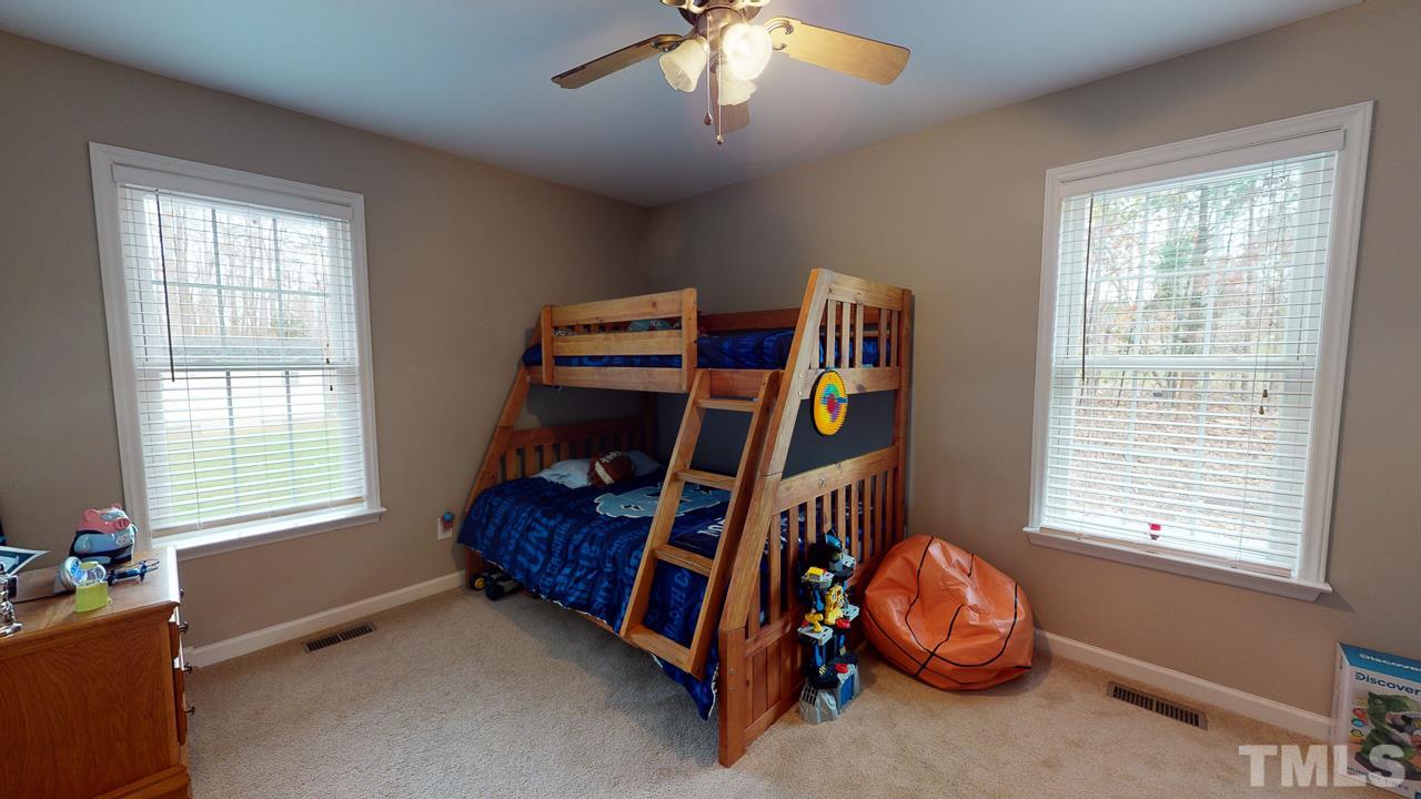 342 Punch Hill Farm Road Rougemont, NC 27572 - Photo 21 of 30 a bedroom with furniture and a window