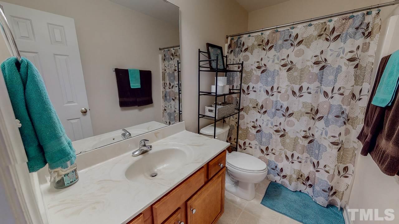 342 Punch Hill Farm Road Rougemont, NC 27572 - Photo 22 of 30 a bathroom with a sink toilet and shower