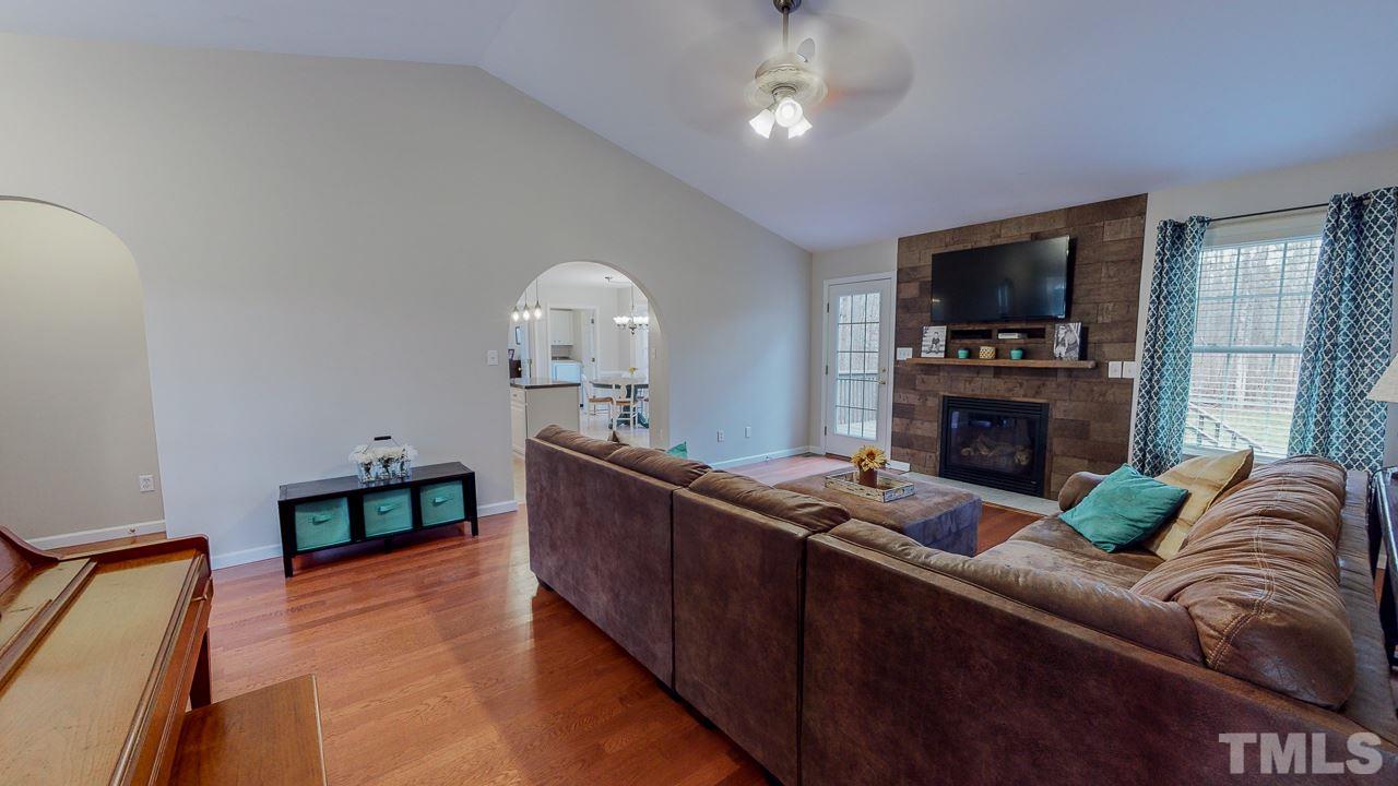 342 Punch Hill Farm Road Rougemont, NC 27572 - Photo 25 of 30 a living room with furniture a flat screen tv and a fireplace